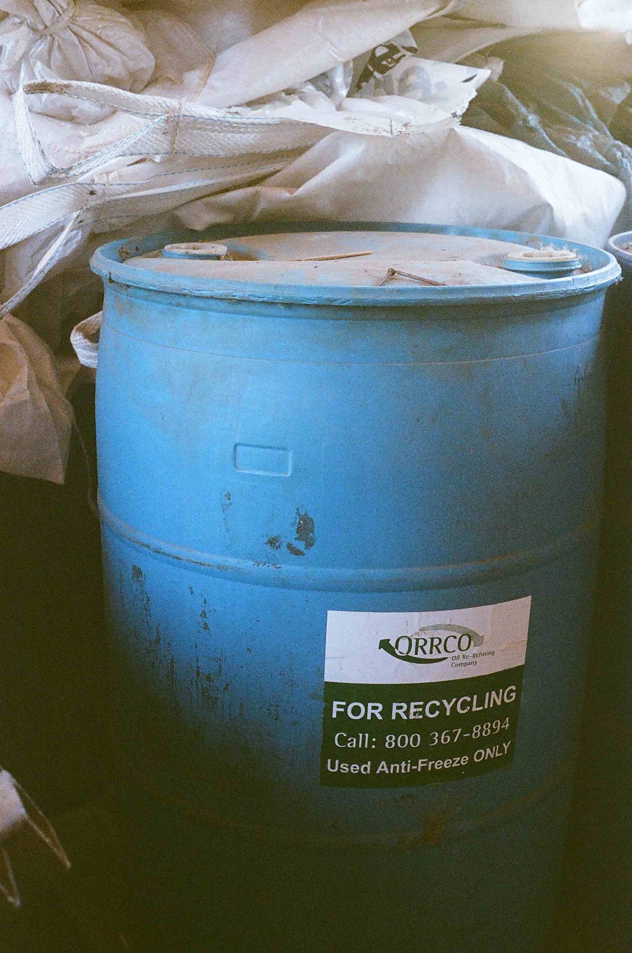  Used anti freeze is stored in a barrel before transporting it to a recycling facility. 