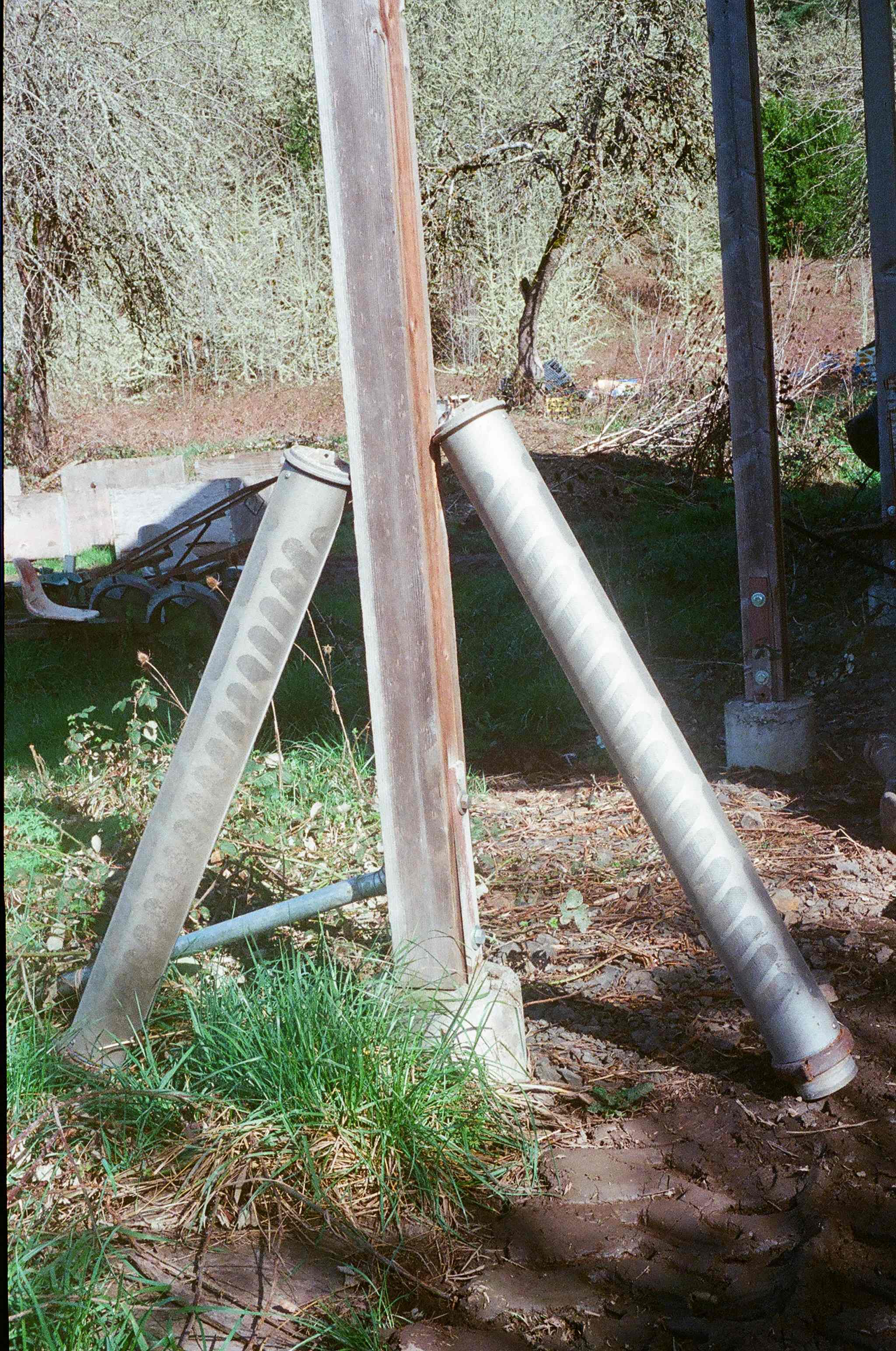  The two cylinders leaning against the post are fish screens that we use on our irrigation pump intake to keep fish of all sizes from getting sucked into the irrigation system. 