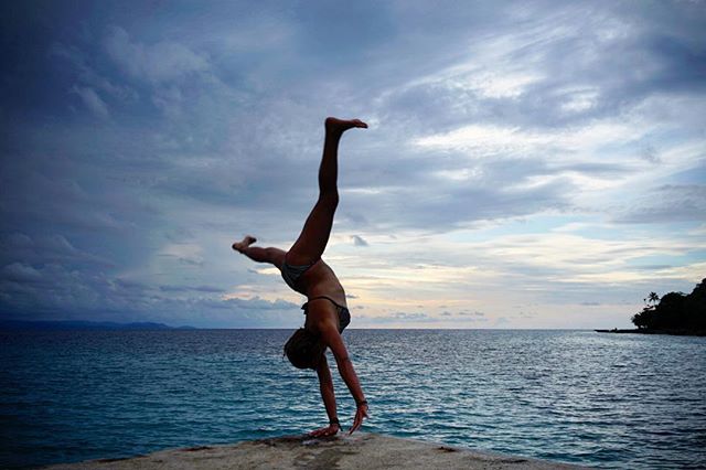 Anouk cartwheeling off the dock in Panama