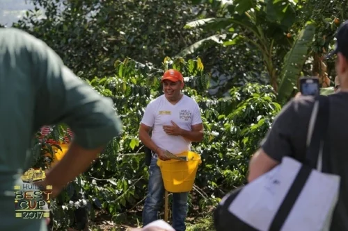 Elkin Guzman discussing how they measure sugar content in the cherry, to determine the optimal time for picking each varietal