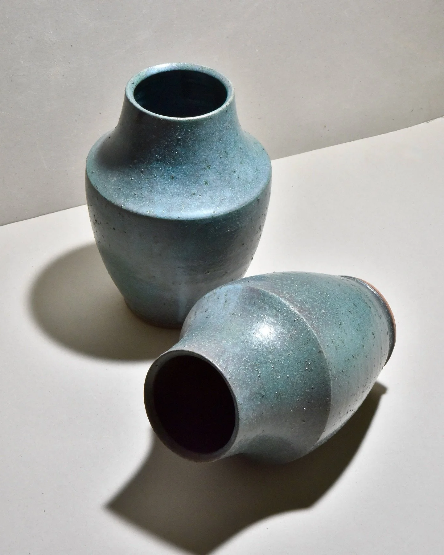 Mist vase in different glazes over the last few years. The shape has changed a little with the neck and base both getting narrower to create more tension with the wide section.