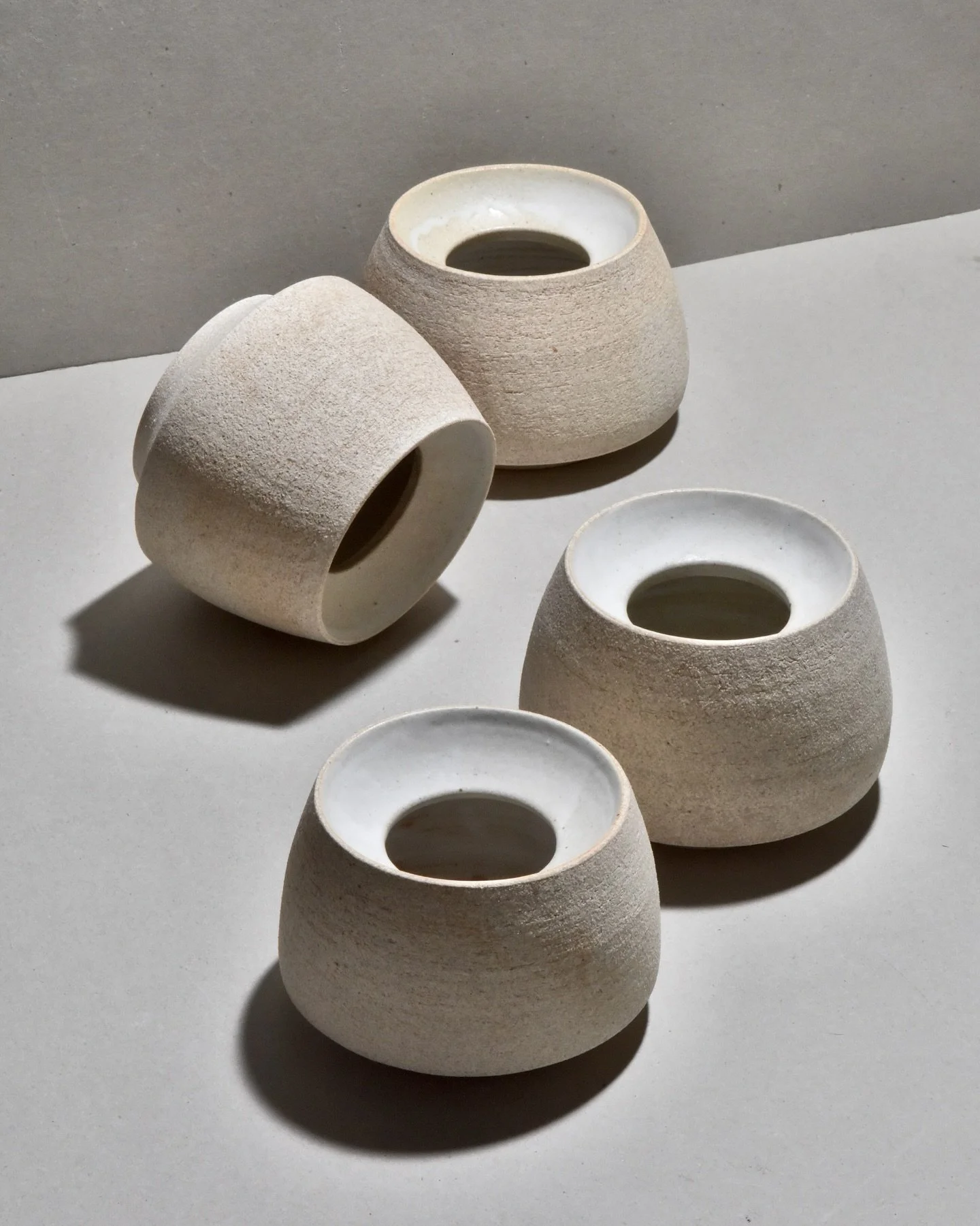 Recessed vases in Oatmeal clay. The last photo shows one of these pieces freshly thrown on the potter’s wheel. The vases have more texture after firing because of the sand in the clay, called grog, and some surface trimming with the loop tool.