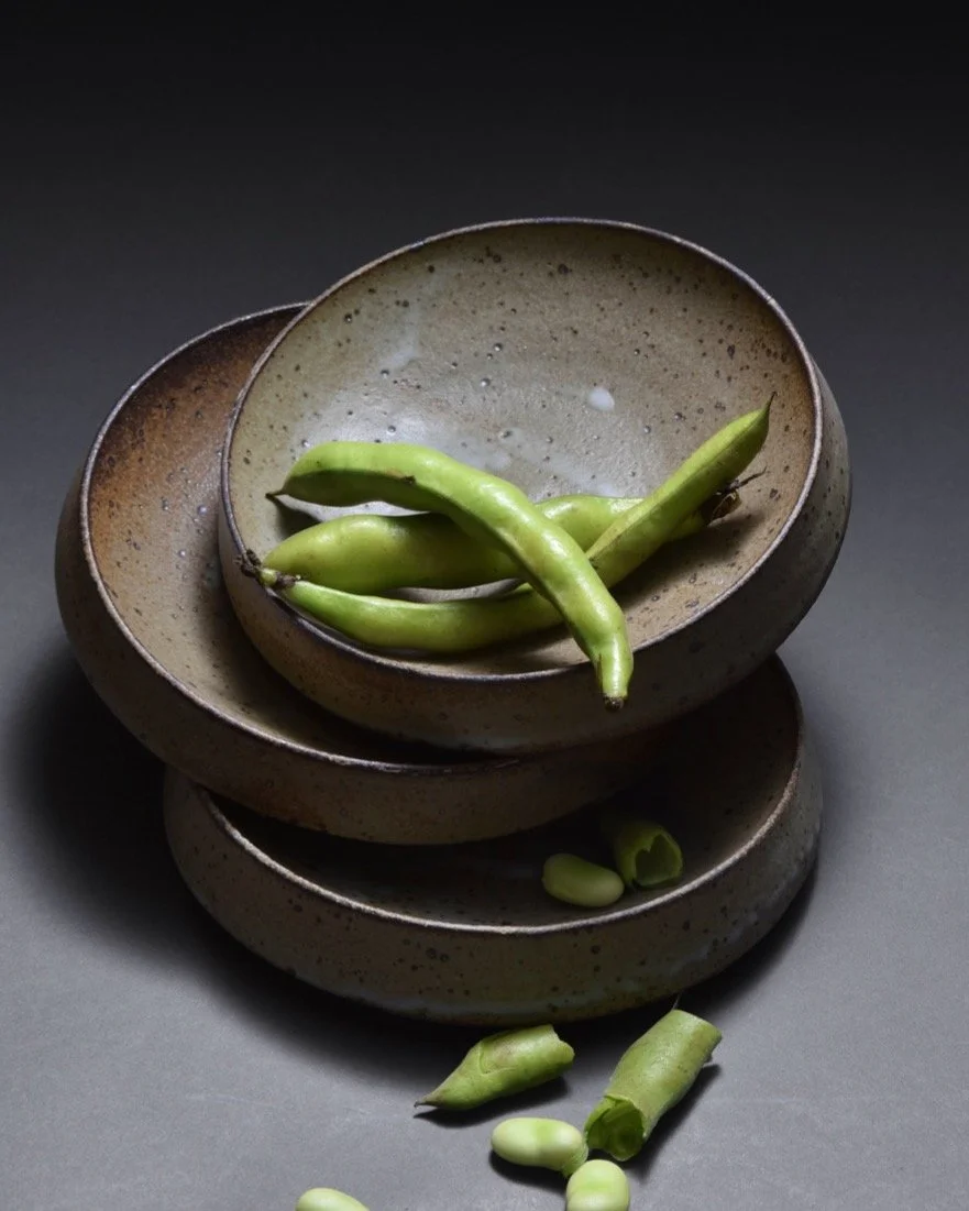 Exploring these low serving bowls with angled sides. They're made partially hollow to reduce weight and help create the profile that combines a bowl shape with a slanted side.
