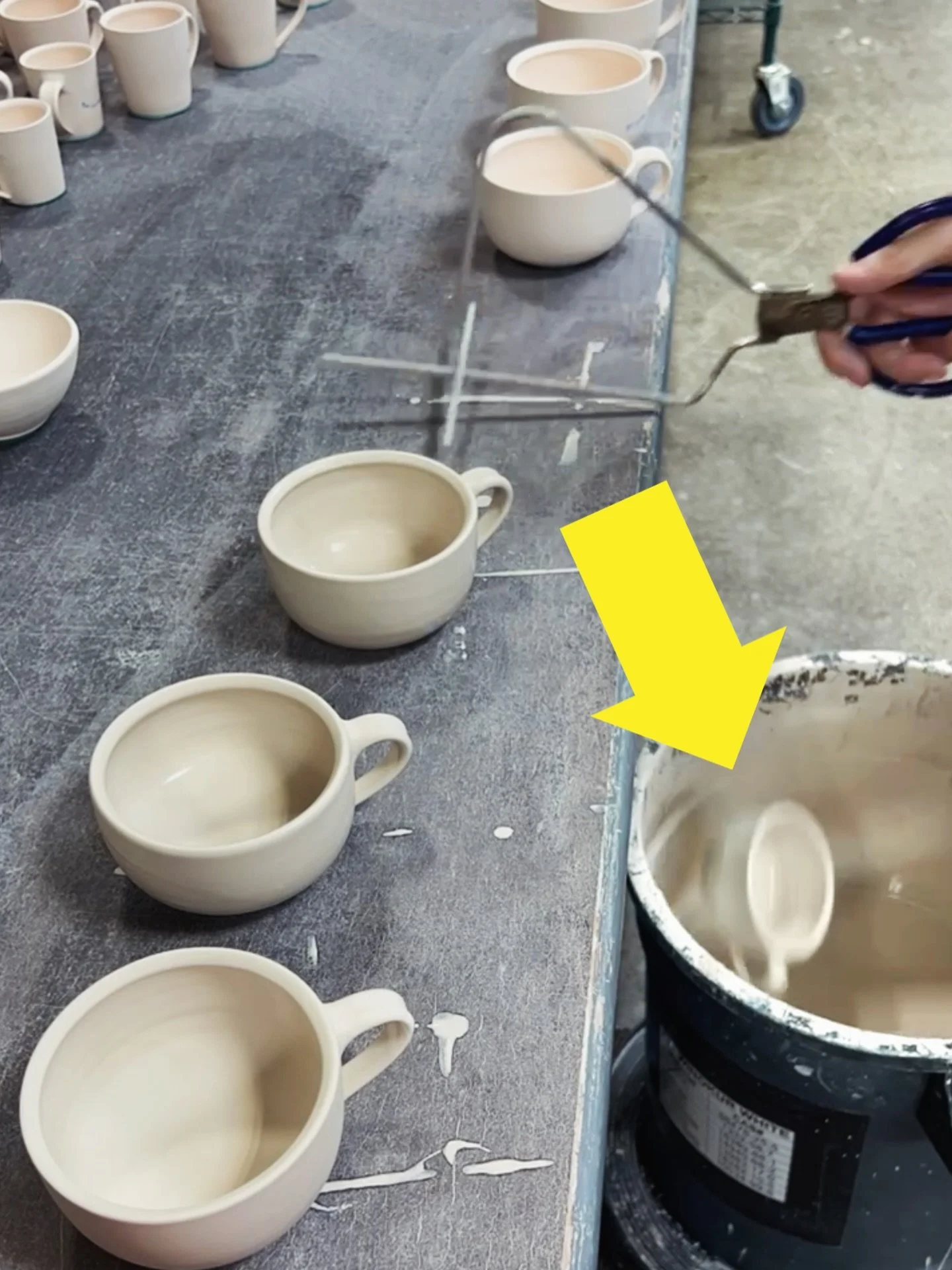 Oops! Poor release from the tongs while glazing. Luckily, the mug fell in the bucket instead of on the floor. It was wiped clean and will be glazed again after it dries.