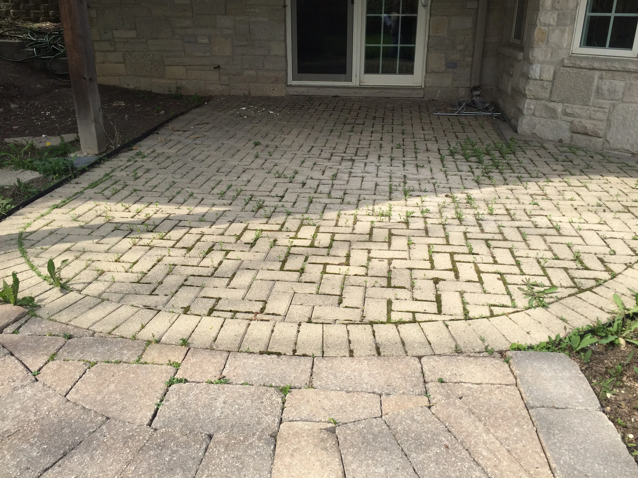 Look at the stone on the house. The patio Hardscape area cheapens it. It's horrible and this is what people are paying for? I don't think one homeowner would want this "quality work" at their home.