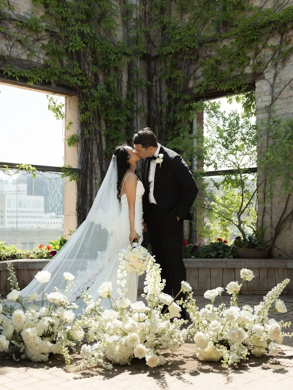 Time for a little fun with two truths and a lie. Can you guess the lie?

1. I did not pluck all the purple and pink (leaving just the red) flowers out of the garden behind where Allyson and Reid would wed.

2. Allyson and Reid are not ones for PDA. I