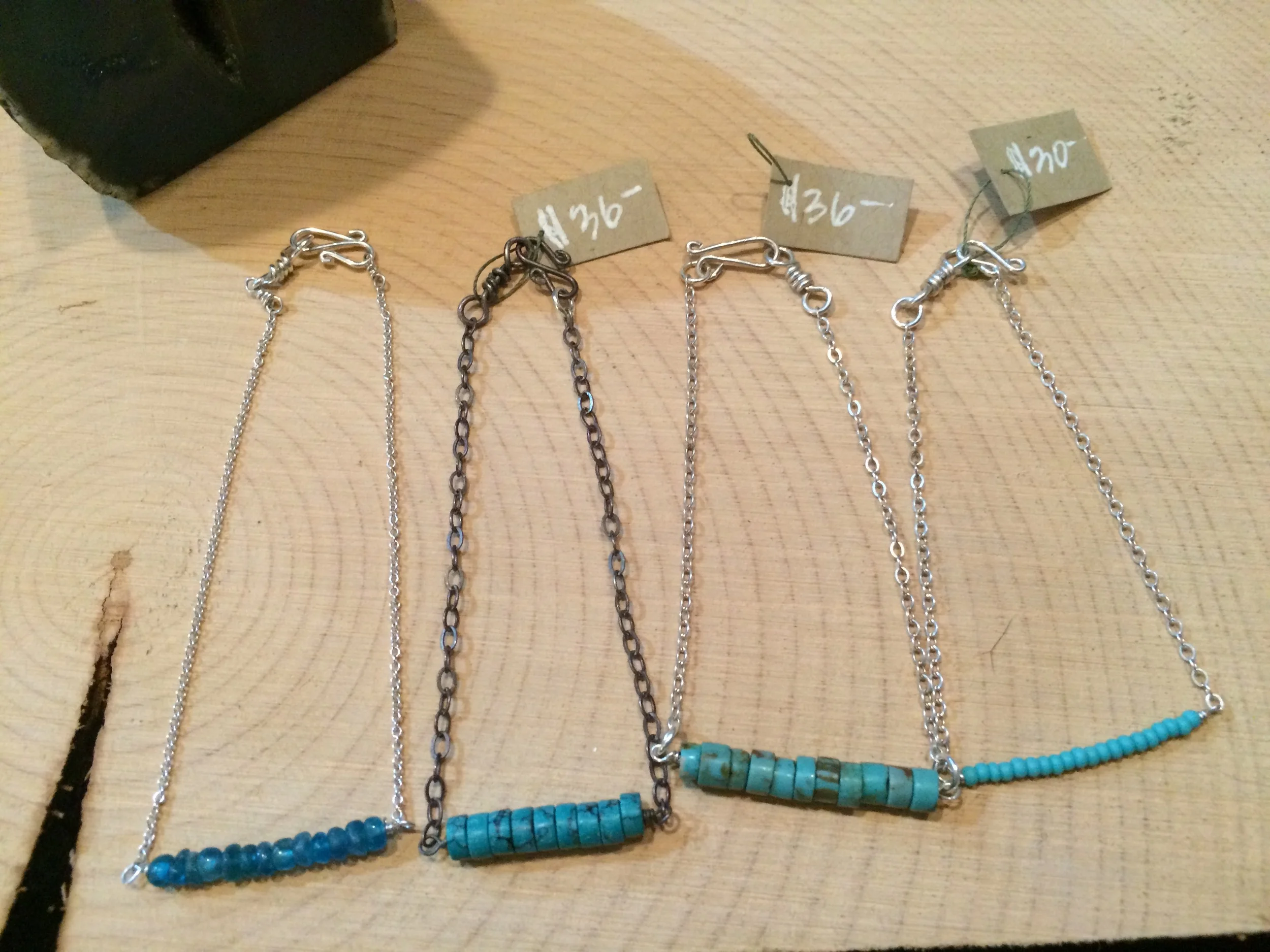 bracelets l to r: apatite + sterling: $36 || turquoise + oxidized sterling silver: $36 || turquoise + sterling silver: $36 || blue glass + sterling silver: $30