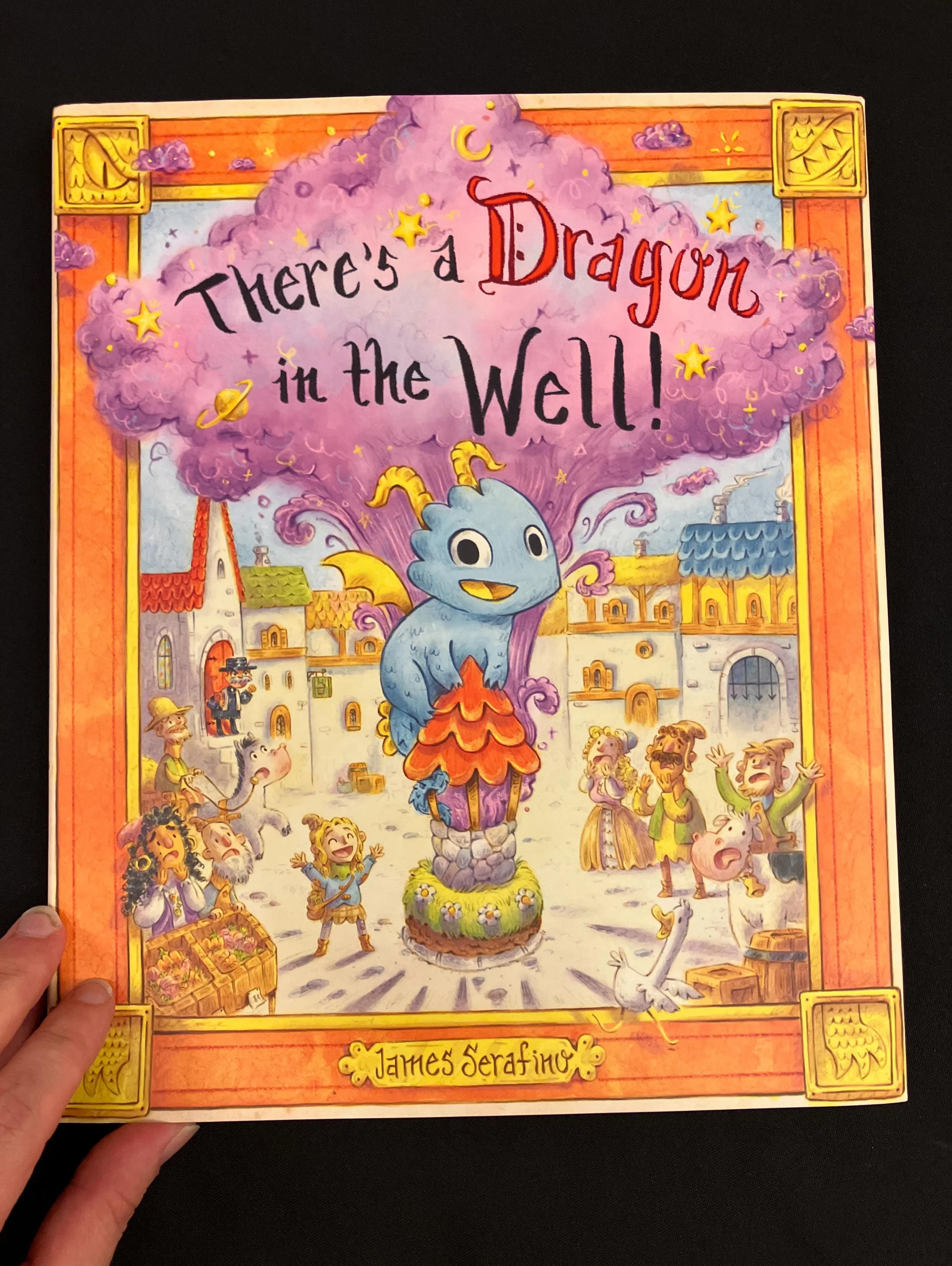 Physical copies! It&rsquo;s always fun to get a new book in your hands, There&rsquo;s a Dragon in the Well! Out September 1st! Pre orders available everywhere! @chroniclekidsbooks Link in Bio!