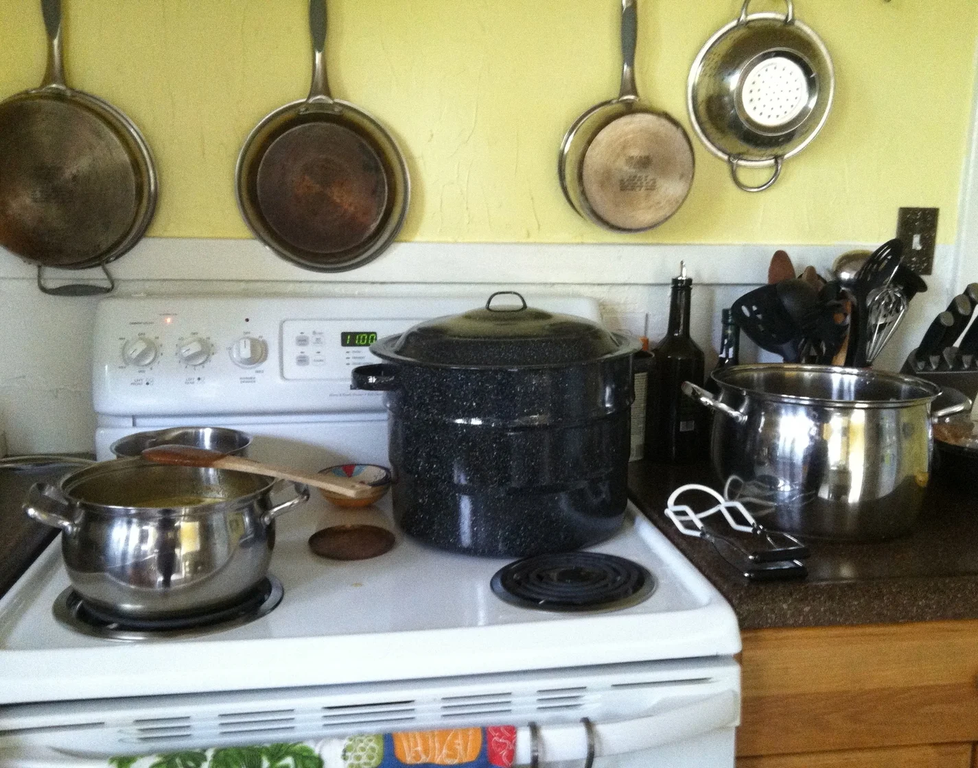 My home canning set-up: the recipe, water bath canner, jar lifter, and second pot for heating jars.