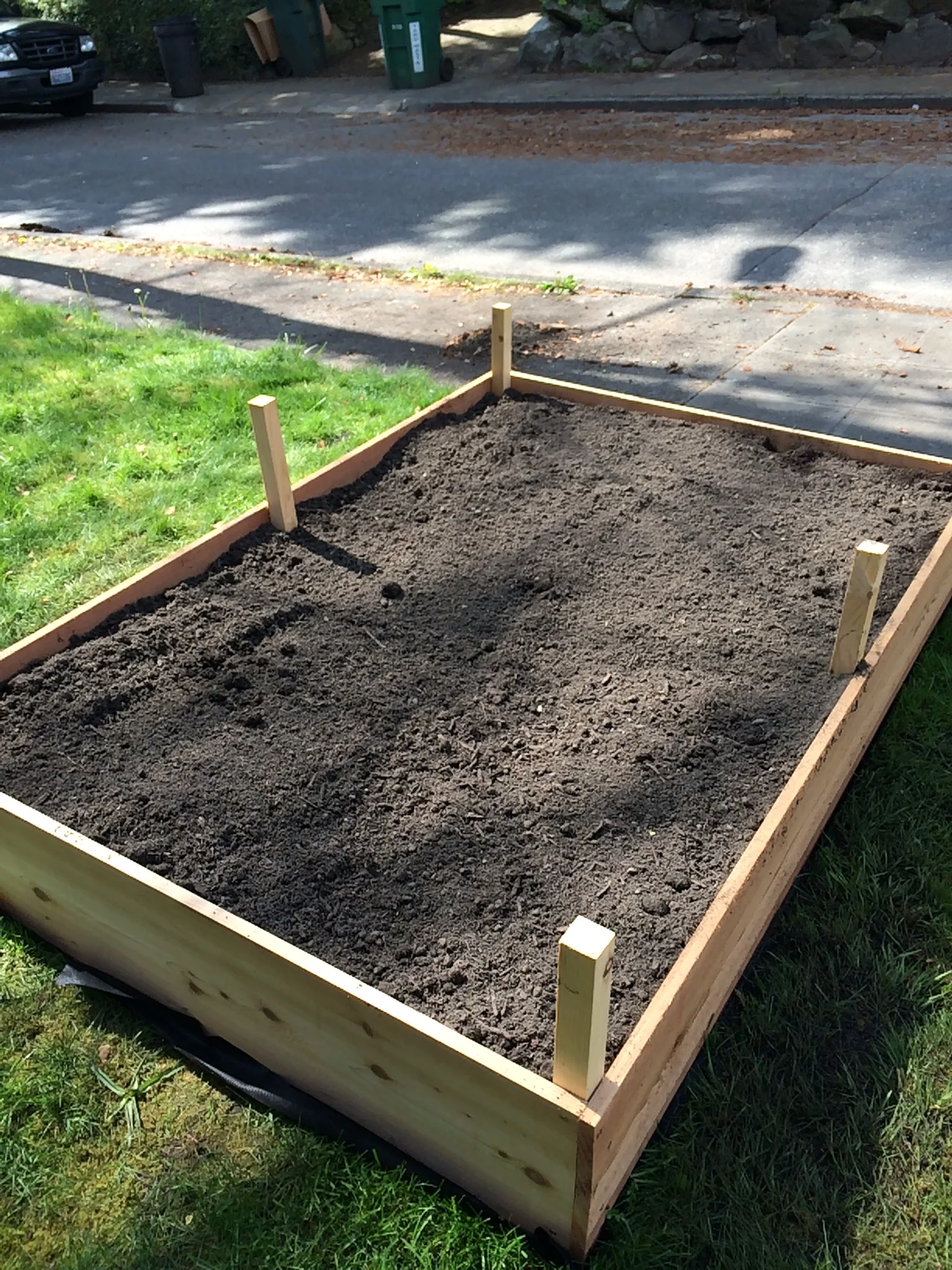 It takes a LOT of soil to fill a box like this and raking it in is not for the faint of heart, but OH SO WORTH IT