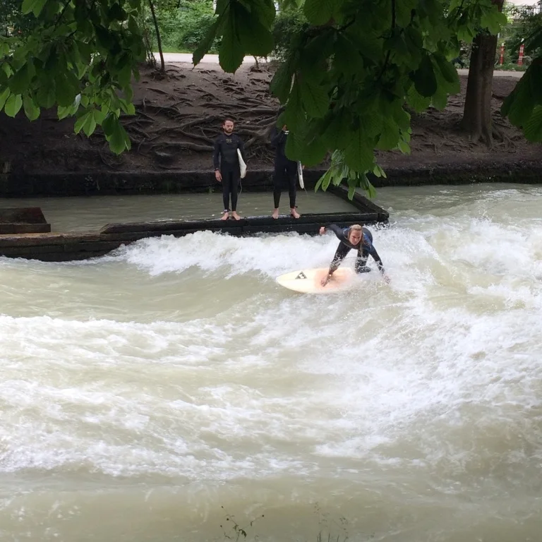 Rad babe surfing the Eisbach river in the English Garden
