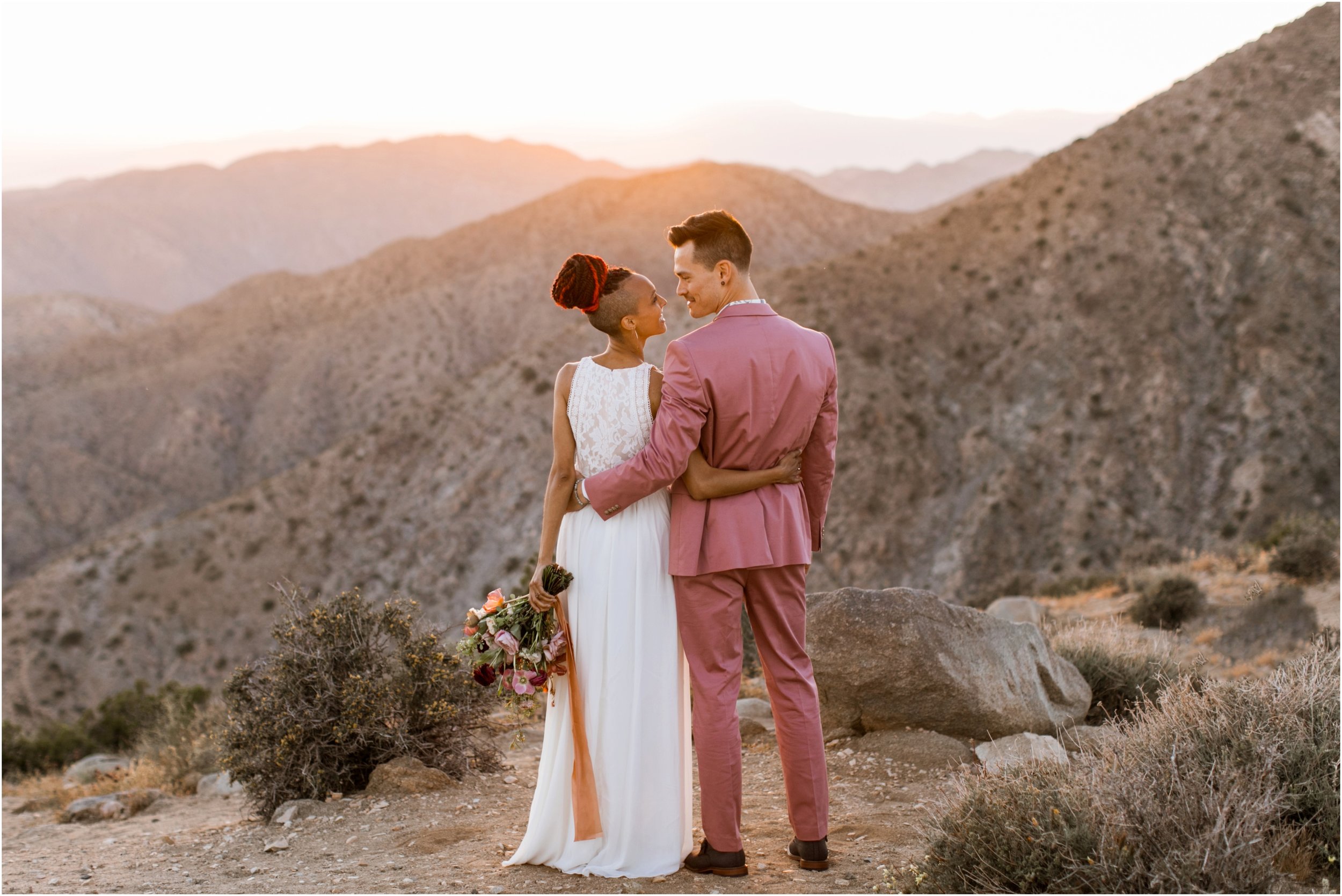 Joshua Tree Wedding, Joshua Tree Elopement, Joshua Tree Proposal, Joshua Tree National Park Wedding, Joshua Tree National Park Elopement, Elopement Photographer, Elopement ideas, Joshua Tree National Park, Joshua Tree, Desert engagement session, desert wedding ideas, Joshua Tree wedding venues, Desert elopement, Desert wedding, Boho bride, boho wedding, Mauve suit, mauve grooms suit, pink grooms suit, pink suit, coachella wedding, surprise proposal, Mandi Lynn Photo
