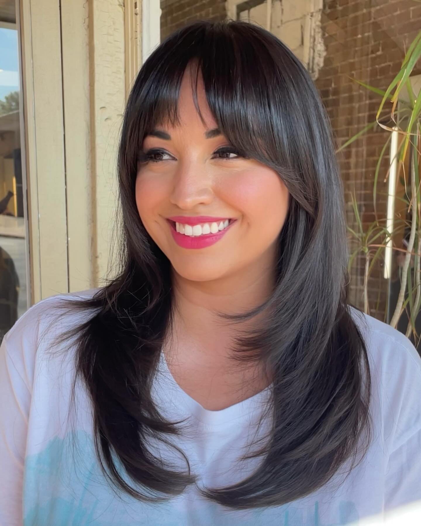 This client had not had her hair cut by a professional in 15 years (had been cutting her own hair) but said she wanted to try bangs and didn&rsquo;t want to attempt to cut them herself. So I went in thoroughly reshaped her layers and created some raz