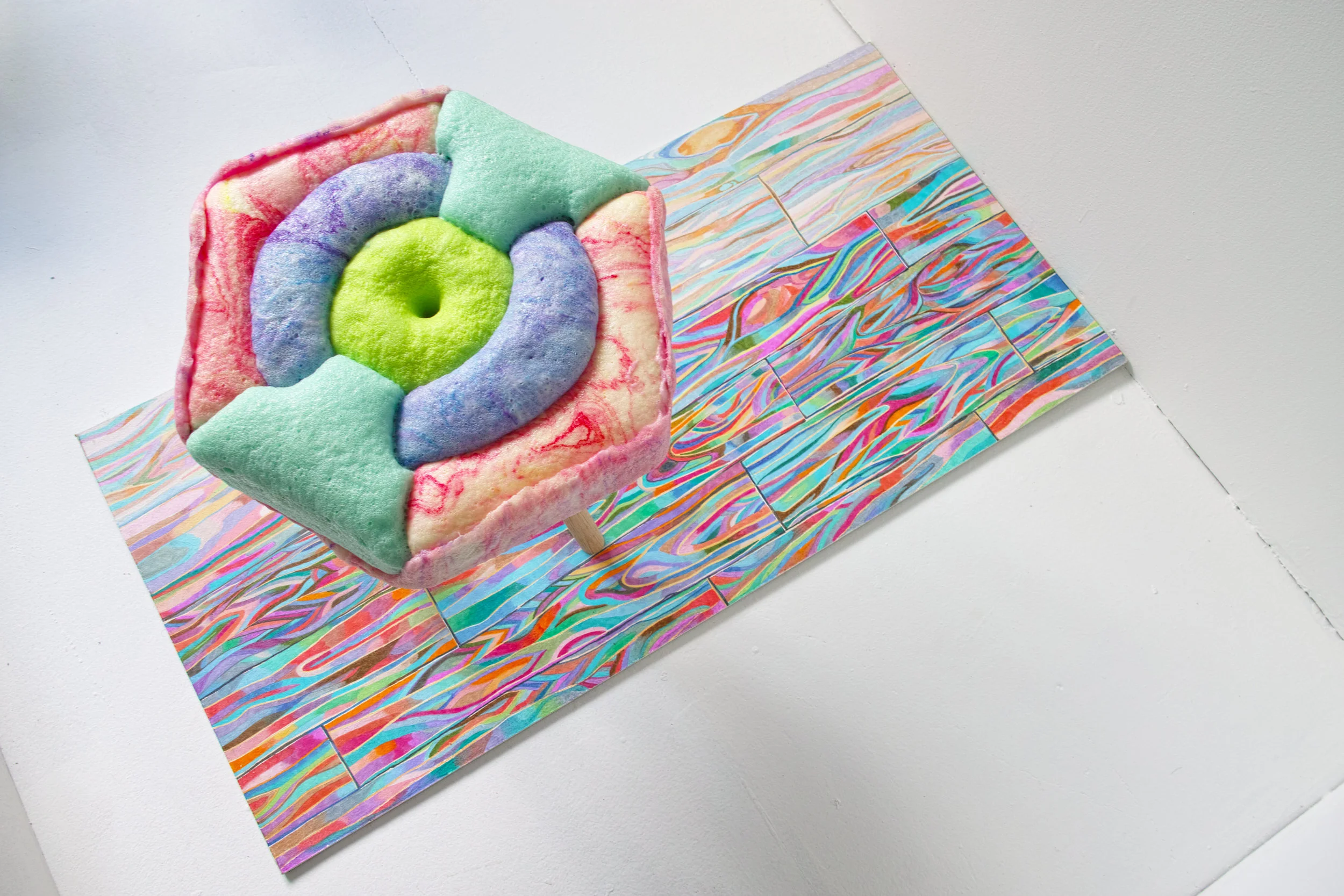 Show Room is a project that discusses the object gesture and language of display. It serves as the stage for the Hard Candy series. The stage includes a 5 degree tilted pedestal, a carpet looking object, a corner panel and a hand drawn wood floor p