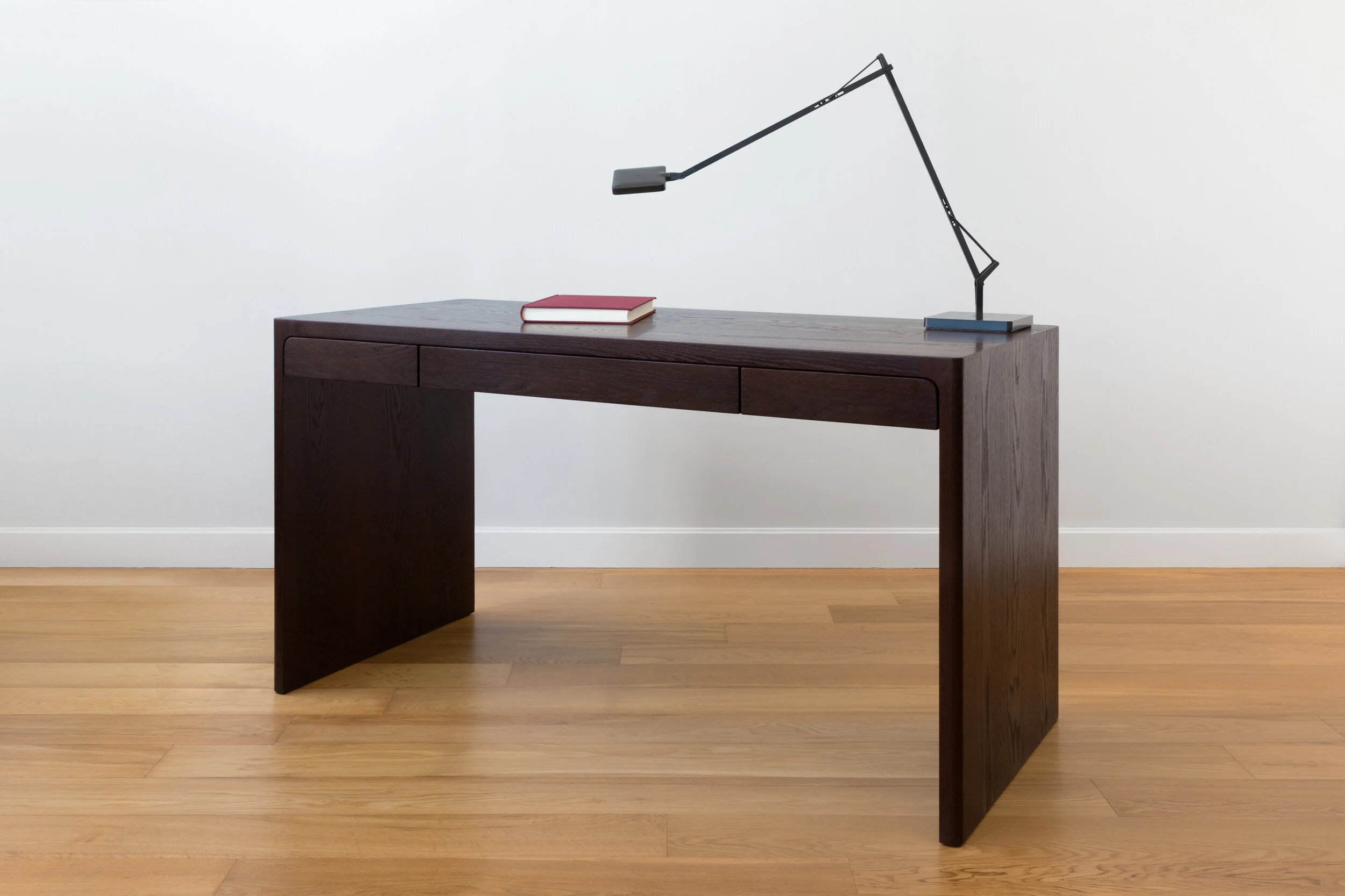 Fina Desk in Dark Oak with felt lined drawers.