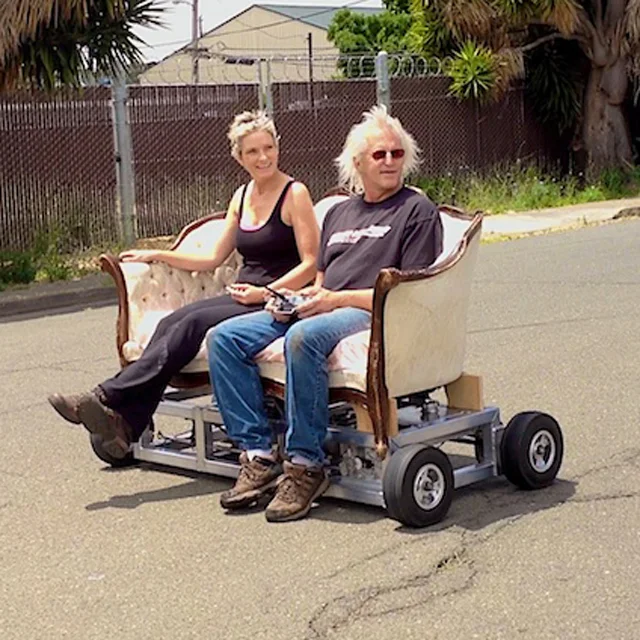 Dave and Vicki Wilson are giants. Literally. And they build fabulous vehicles, like the Chairway to Heaven and the Parlor Car.