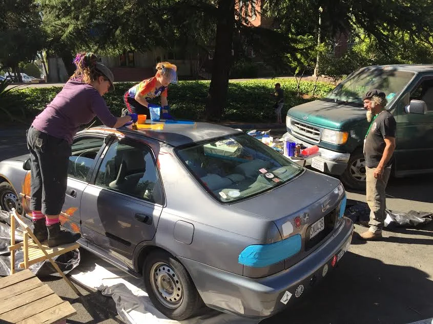 One of last year's Art Car Jam participants, Caroline Miller, with her friend Jack!