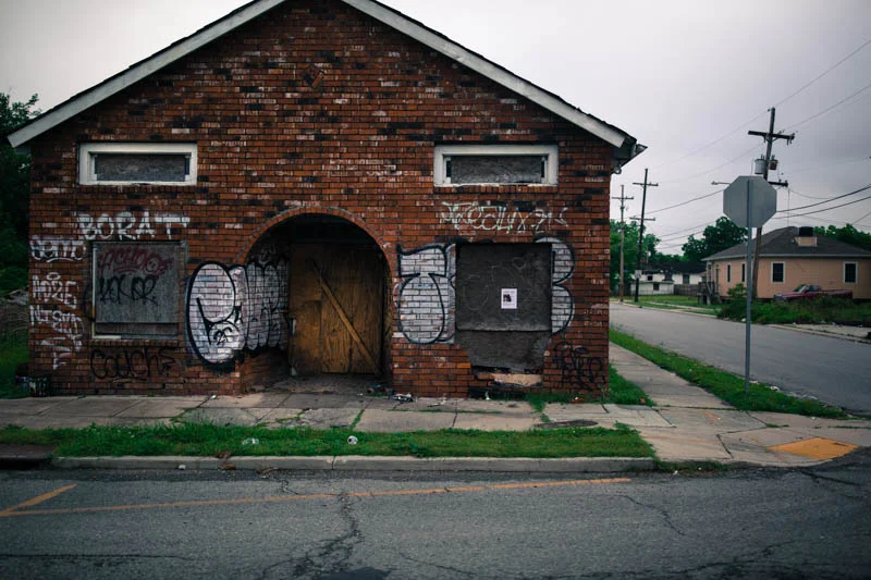 Zack Smith Photography New Orleans Graffiti bricks boarded up ruins