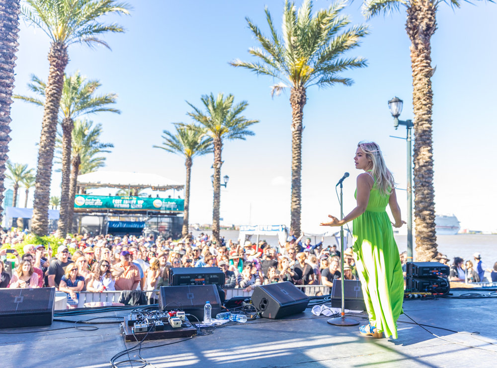 Maggie Koerner performs at French Quarter Fest amongst a sea of fans and the Mississippi River. ©Zack Smith Photography