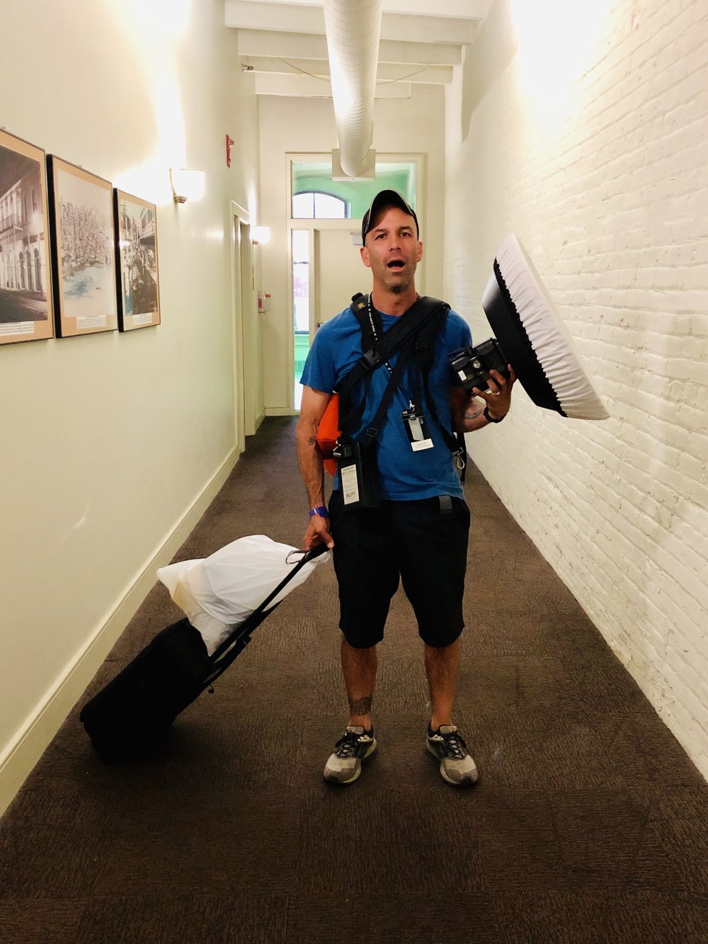 Tired photographer post-fest with gear. Photo by Matt Owens.