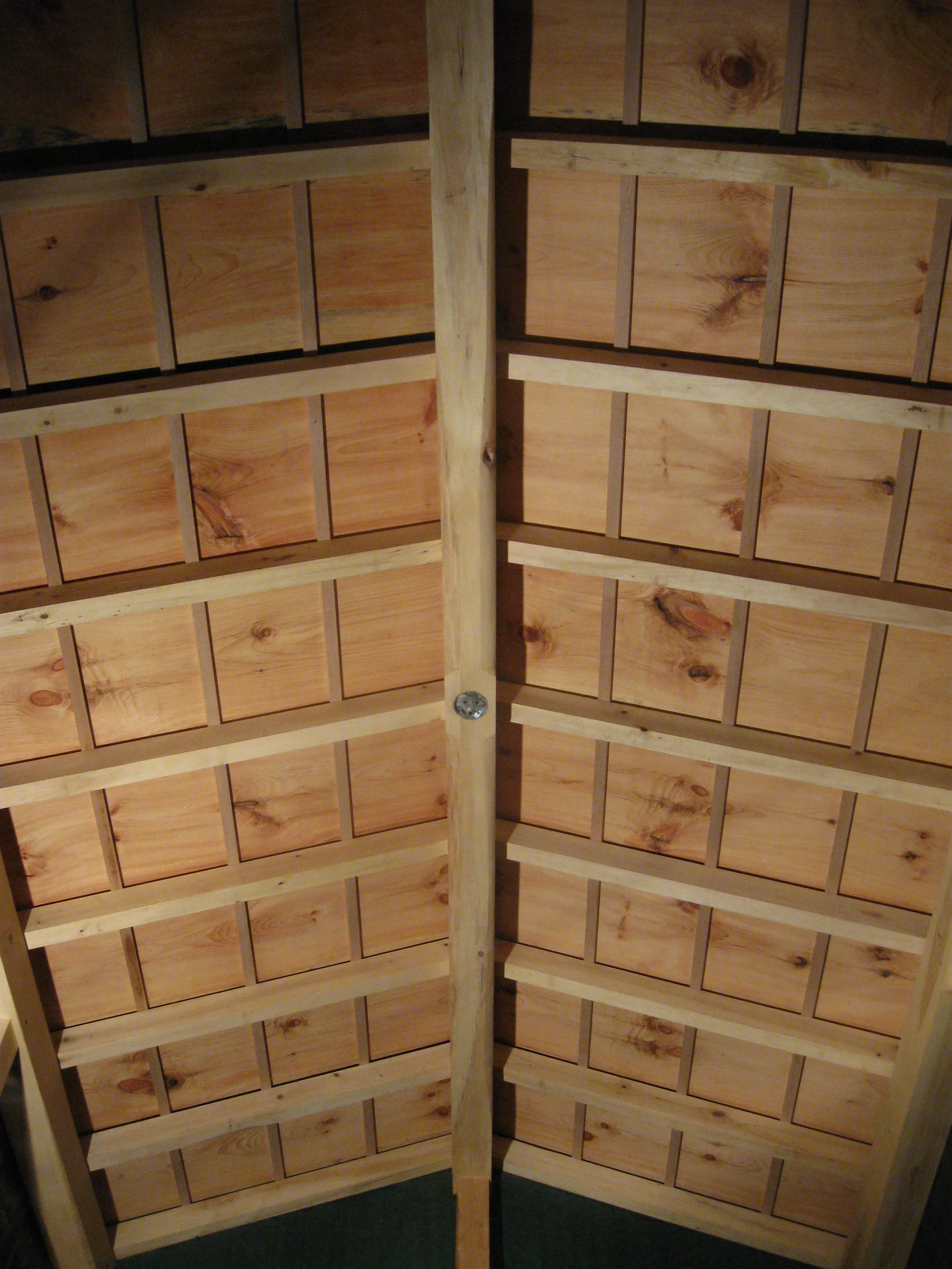  A view of the ceiling, extra wide pine boards set vertical over white oak battens. 