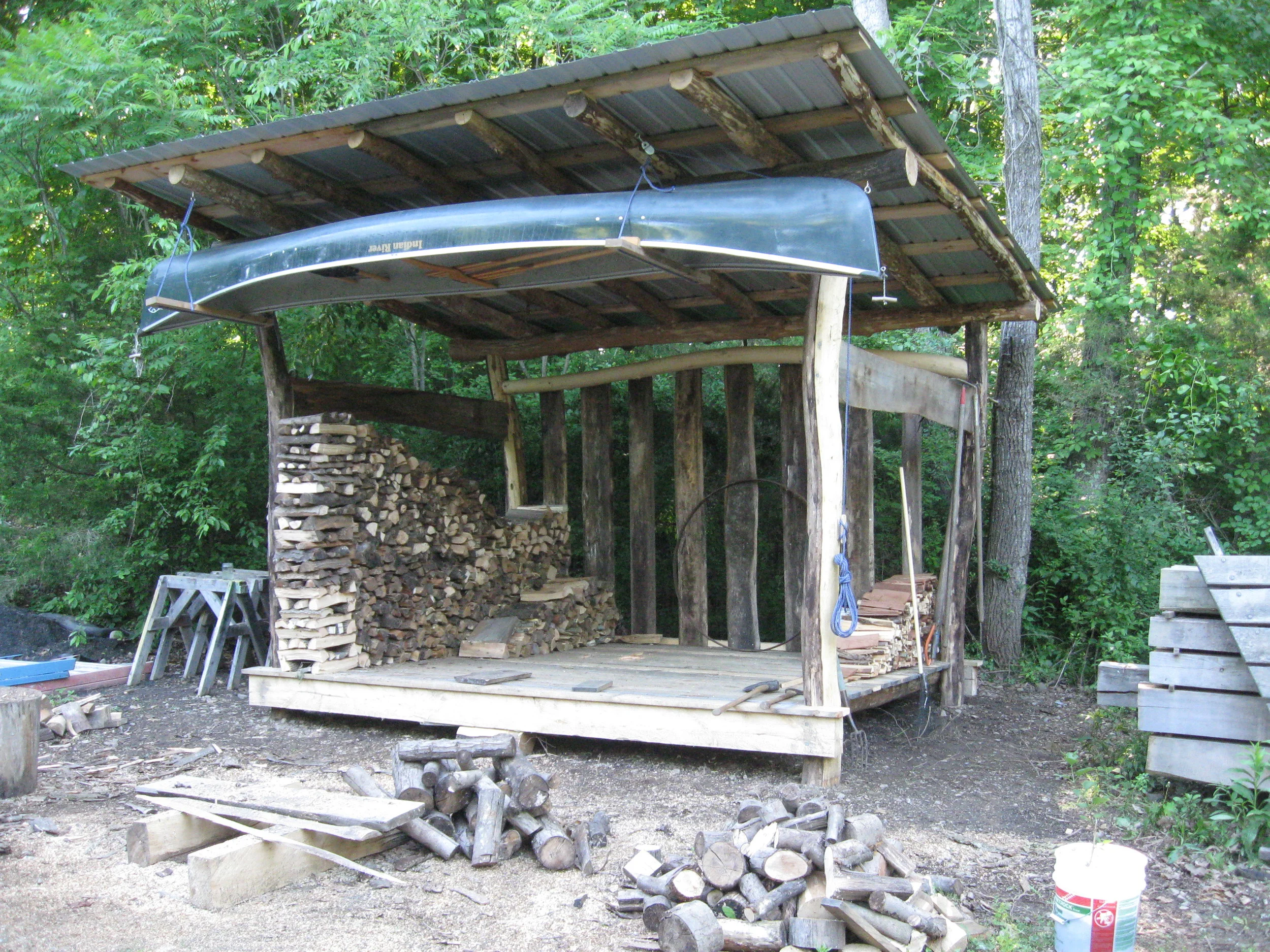  A firewood (and canoe) shed cut from the firewood pile. 
