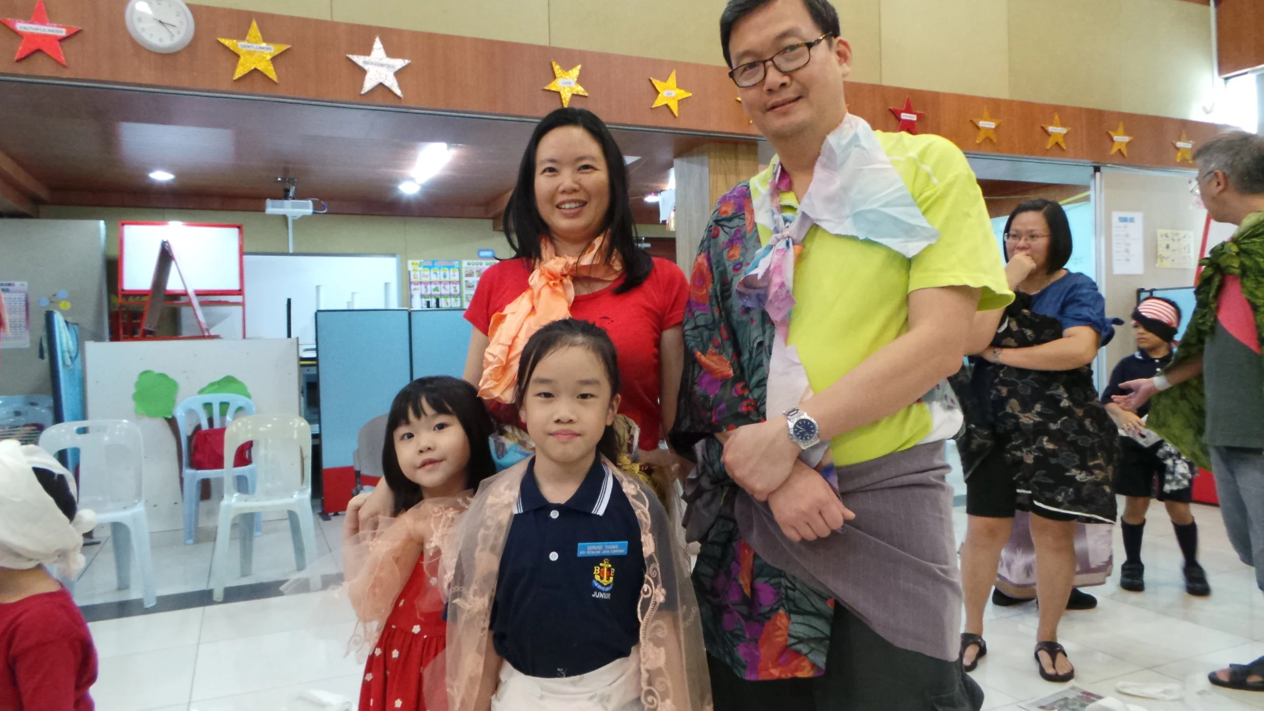 Lovely family with pretty scarves and batik