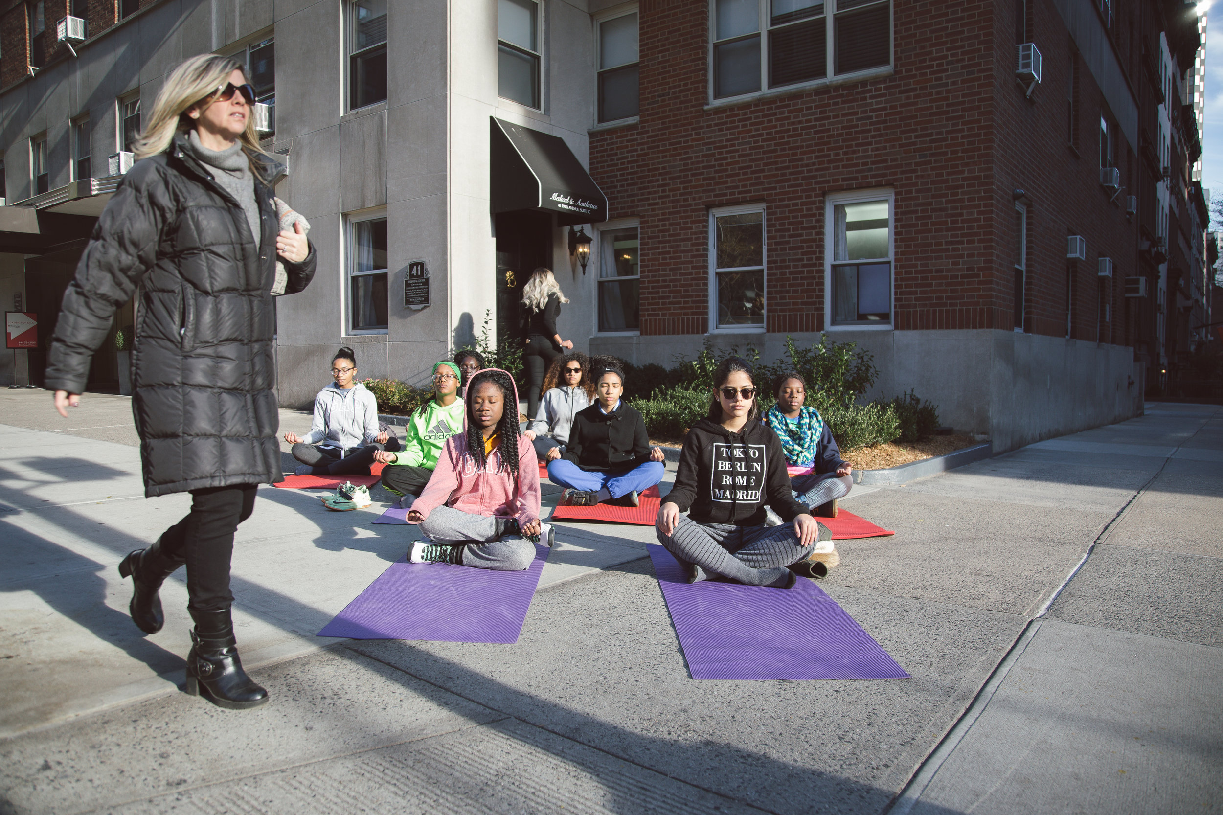 Being able to quiet your mind, and focus inward is a life skill in NYC. Here my students take their studio practice to the streets as they focus inward and meditate outside. 
