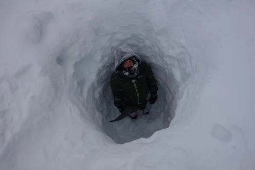 Syd Slater studies the snowpack depth