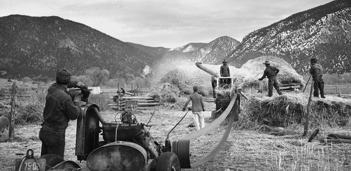Men threshing wheat. Courtesy National Archives, photo no. 521836 Photographer: Irving Rusinow, Questa, NM circa 1941