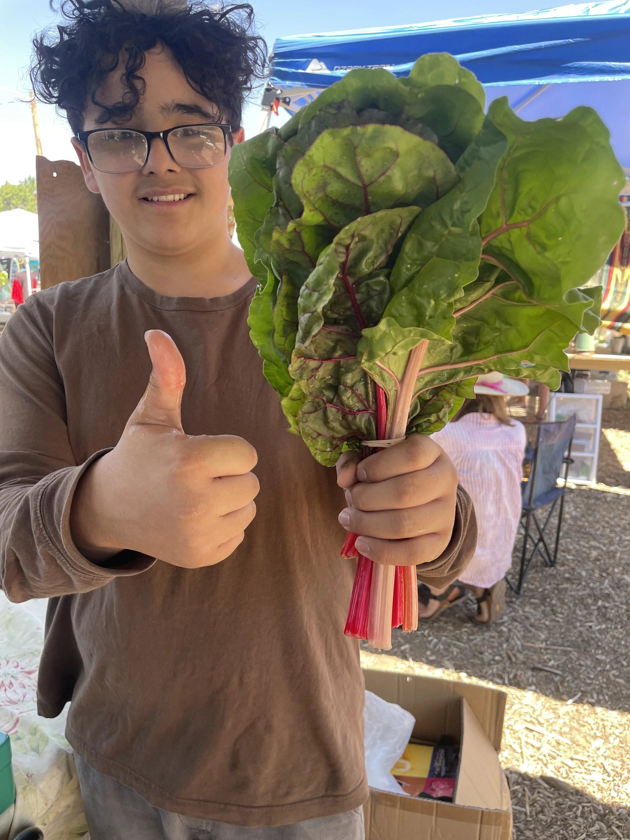dominic and chard at market.jpeg