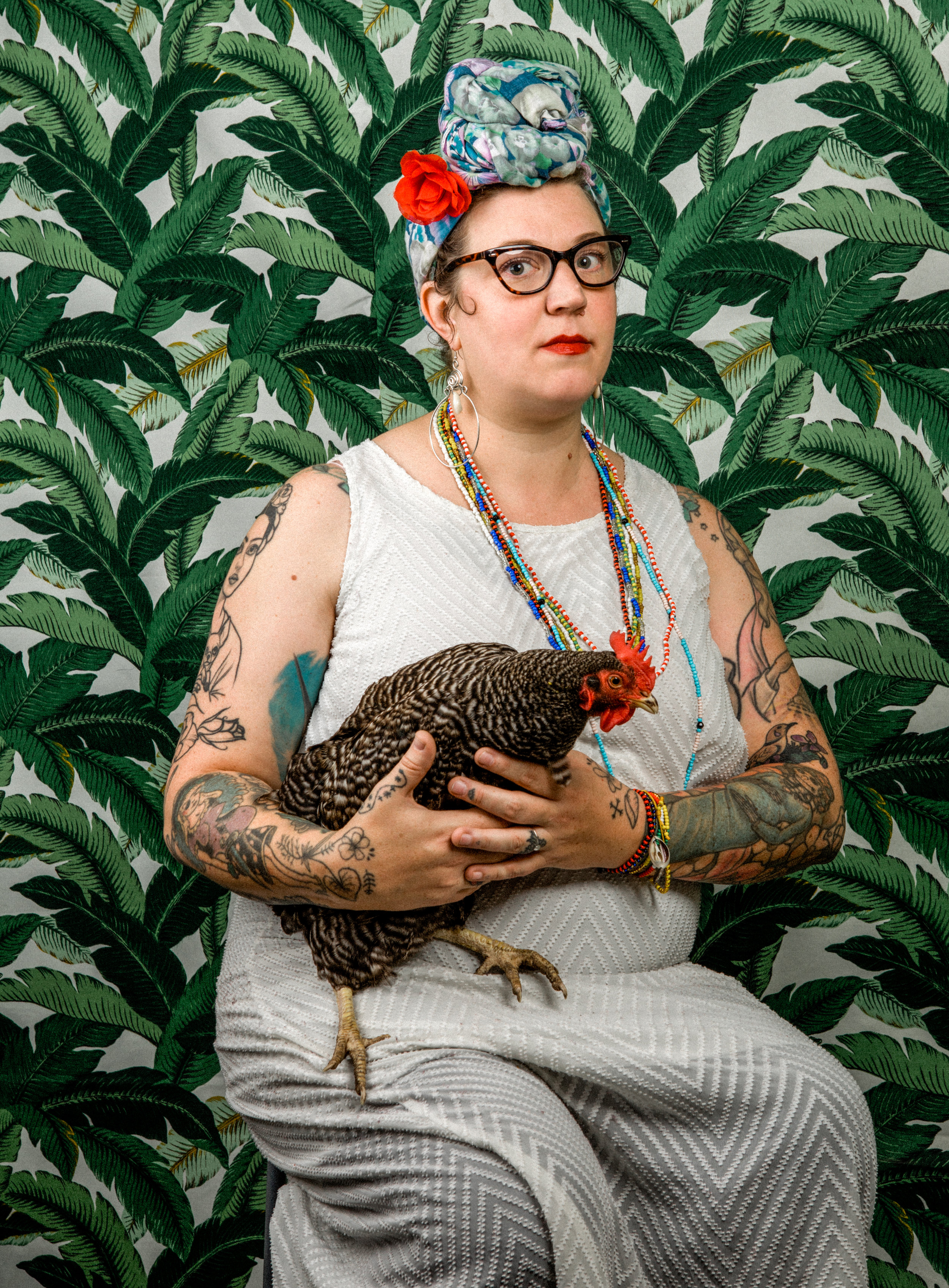 Woman with her chicken by Danielle Spires