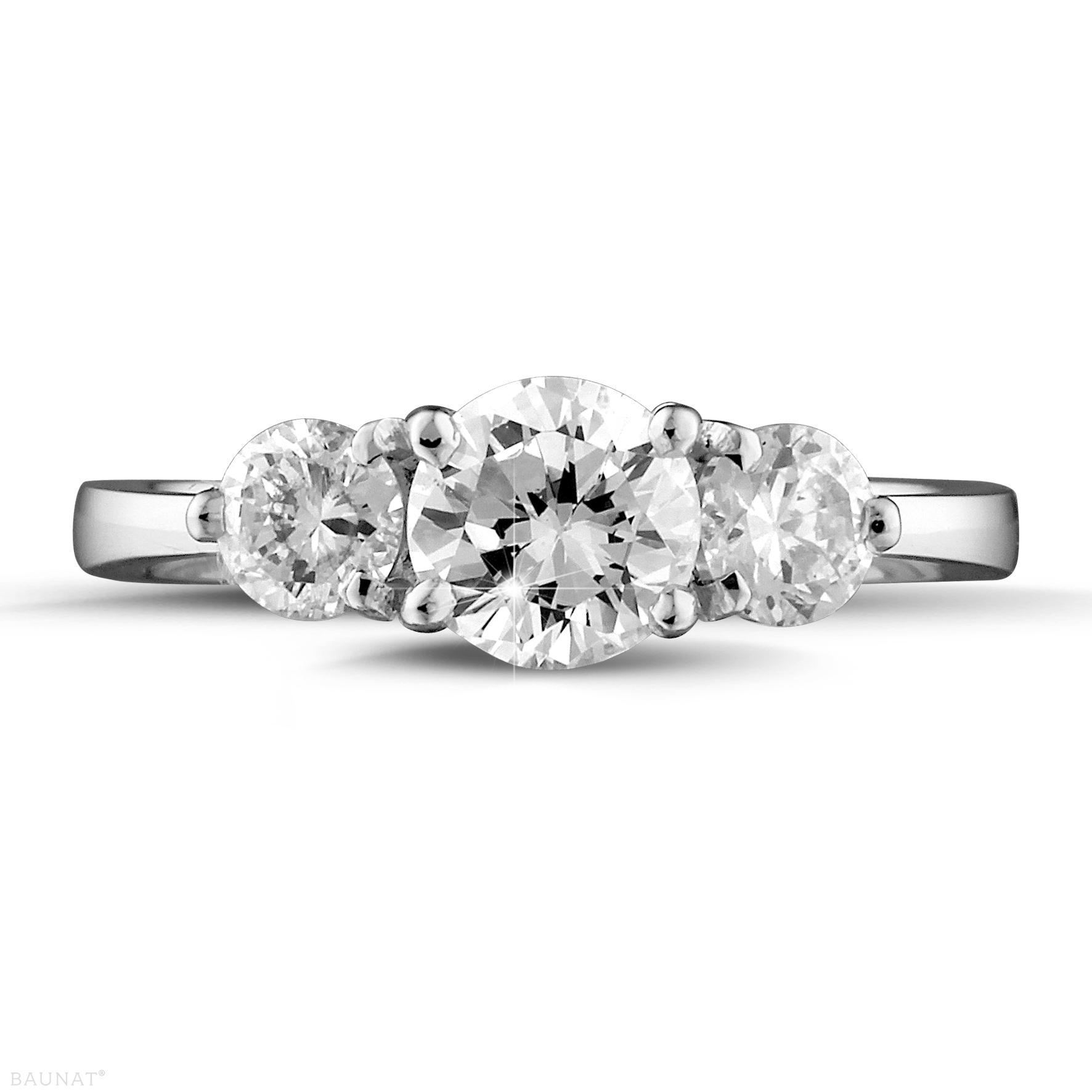 A Trilogy Ring, with a large diamond flanked by two medium sized diamonds 
