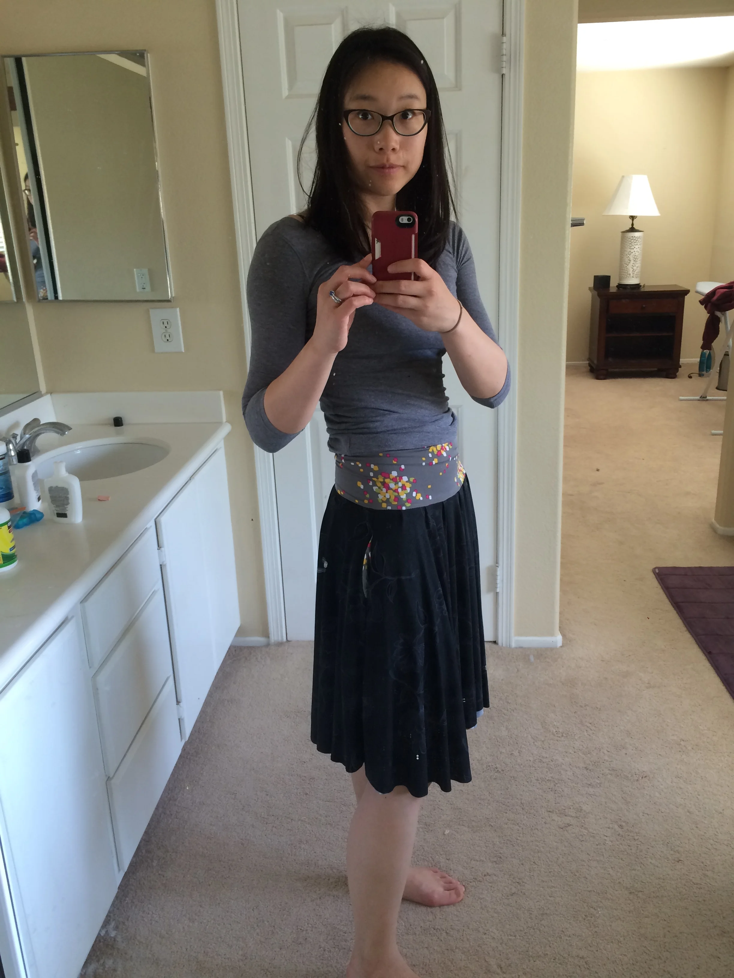 Black floral side with contrasting waistband. It's hard to tell in the pictures, but there are subtle flowers outlined in gray on the black side. 