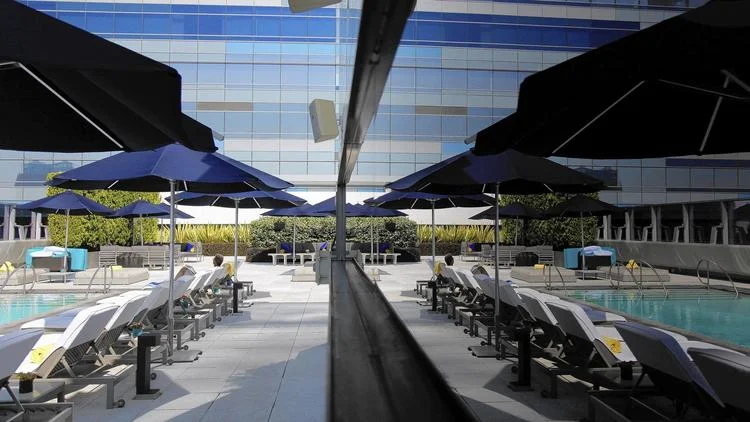 Real estate agents are tracking down absentee owners who don't live in downtown condos and urging them to sell. The last six units at the Ritz-Carlton Residences at L.A. Live, above, sold this year. (Rick Loomis, Los Angeles Times)