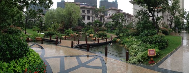 Villas in a luxury compound in Wuxi, in China's eastern Jiangsu province, sit empty after a year while more apartment blocks rise in the distance.