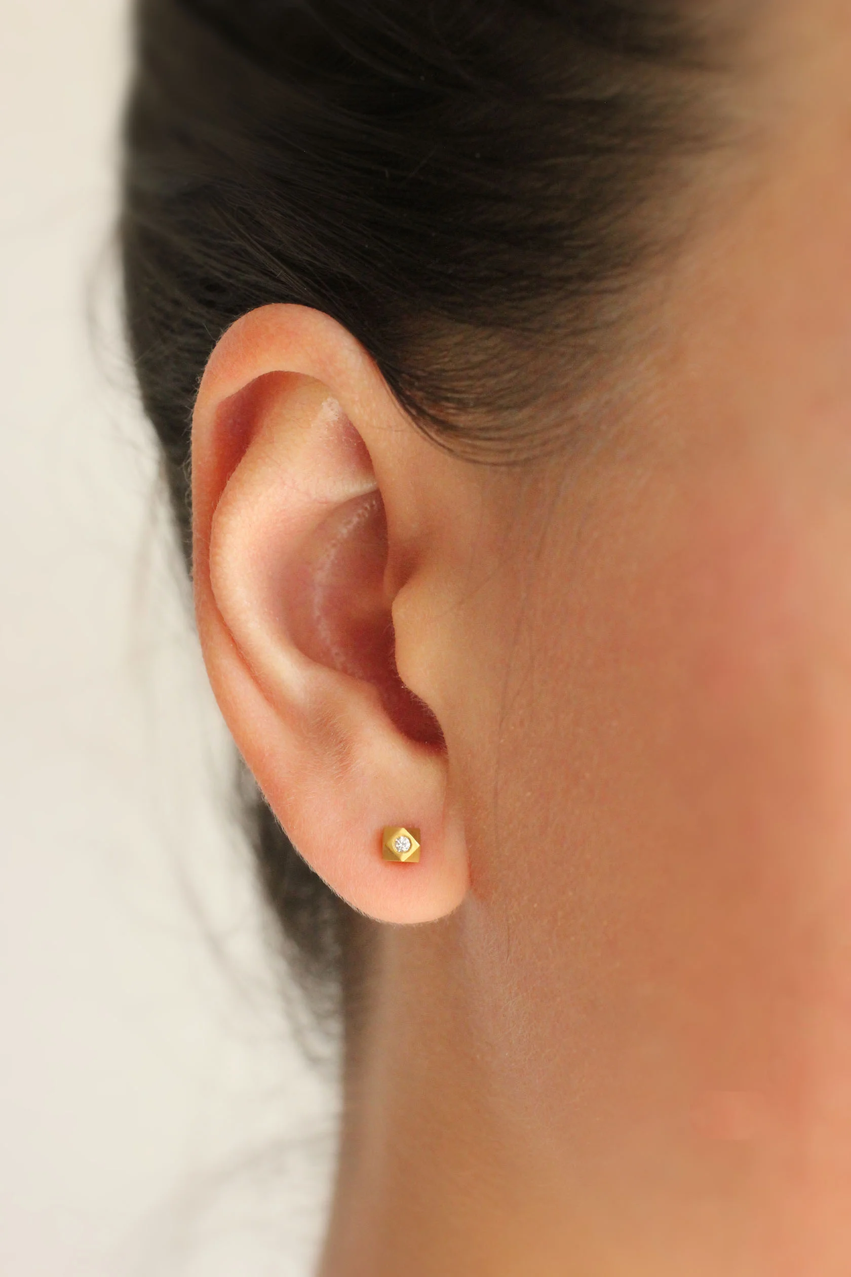 Diamond Cube Earrings on Model.jpg