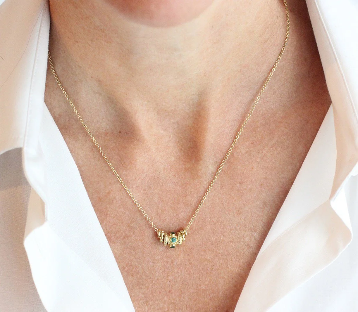 Emerald Rondelle Necklace on Body.jpg