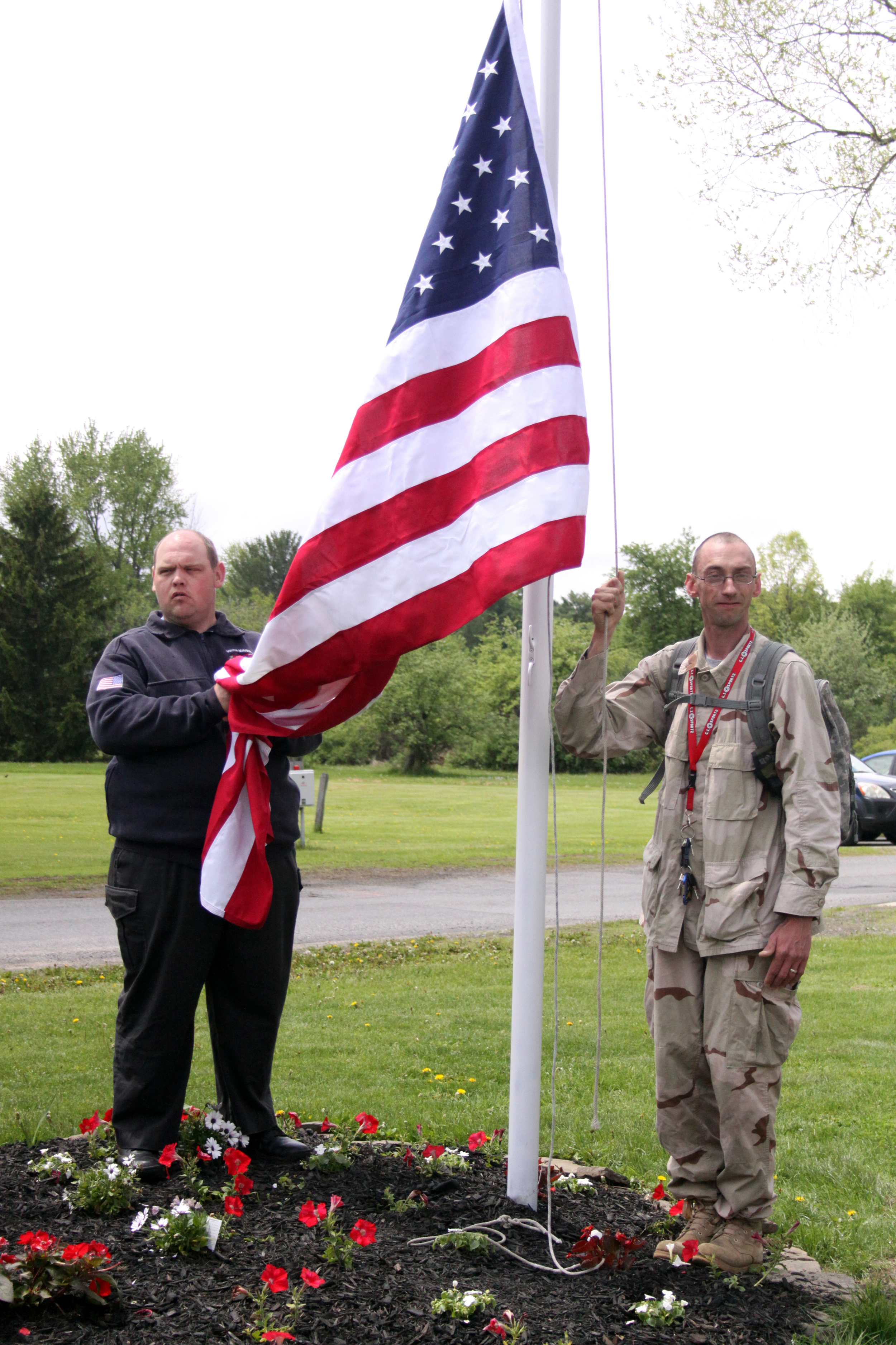 Joe Looman and Patrick Foote prepare to raise the flag.