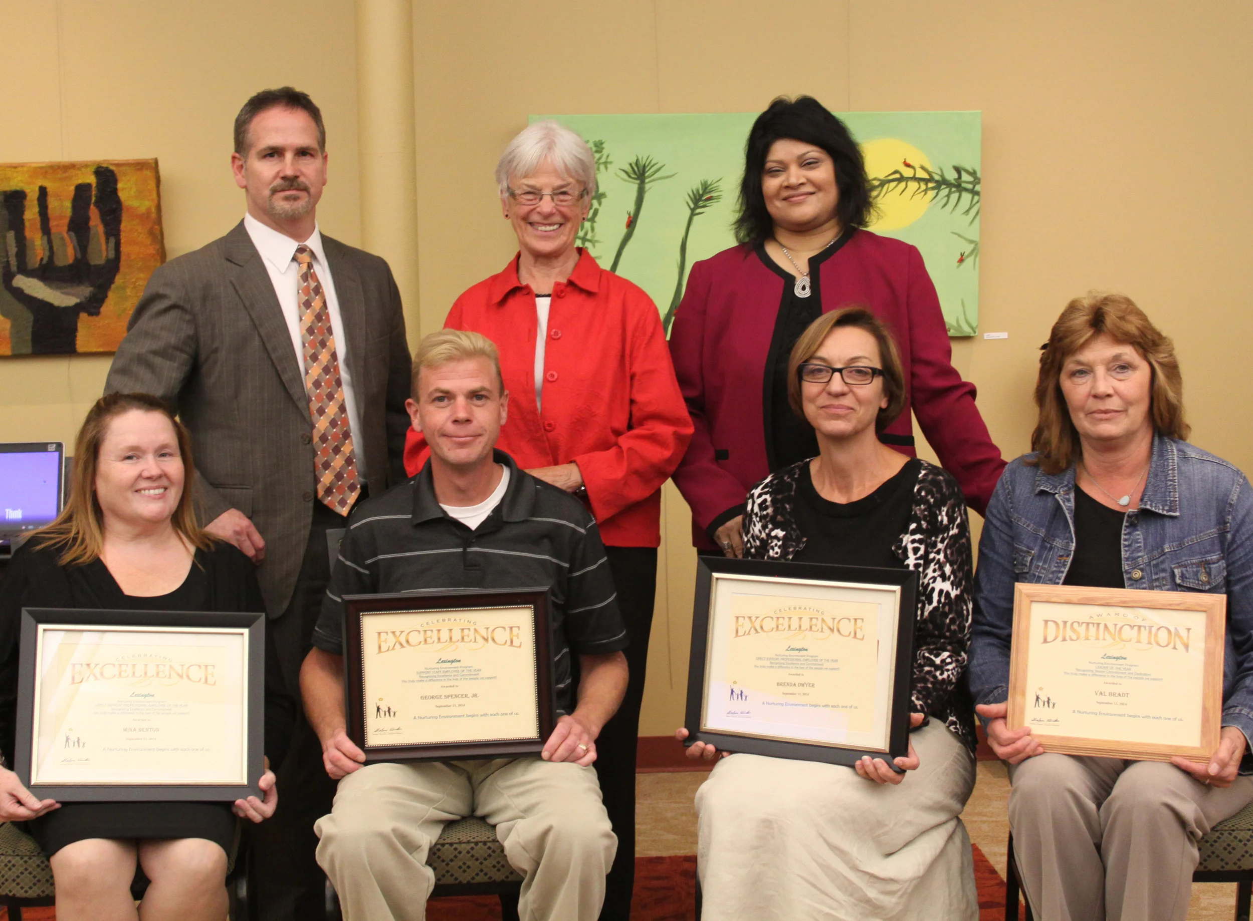 Back row: Lexington Deputy Executive Director Dan Richardson, Board President Judy Schelle and Executive Director Shaloni Winston pose with four of our Employees of the Year: Mina Denton, George Spencer, Brenda Dwyer and Val Bradt.