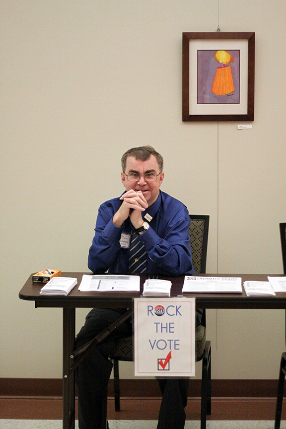 Doug, Public Relations Officer, reminds his fellow conferees to vote!