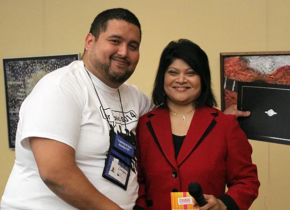 Outgoing President Victor is thanked for his service by Lexington Executive Director Shaloni Winston.