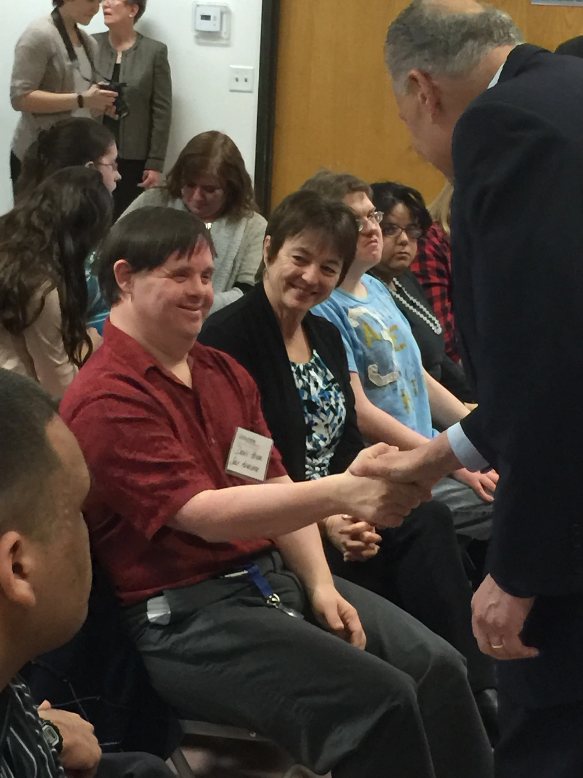 Lexington Self-Advocate Dennis Hoyer shakes Senator Schumer's hand