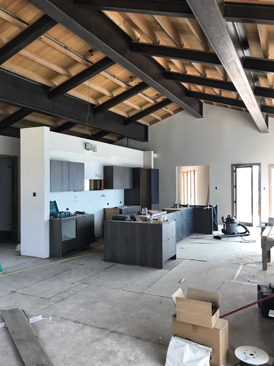 Big Sky Montana home custom interior ceiling with exposed beams and the kitchen in progress.jpg