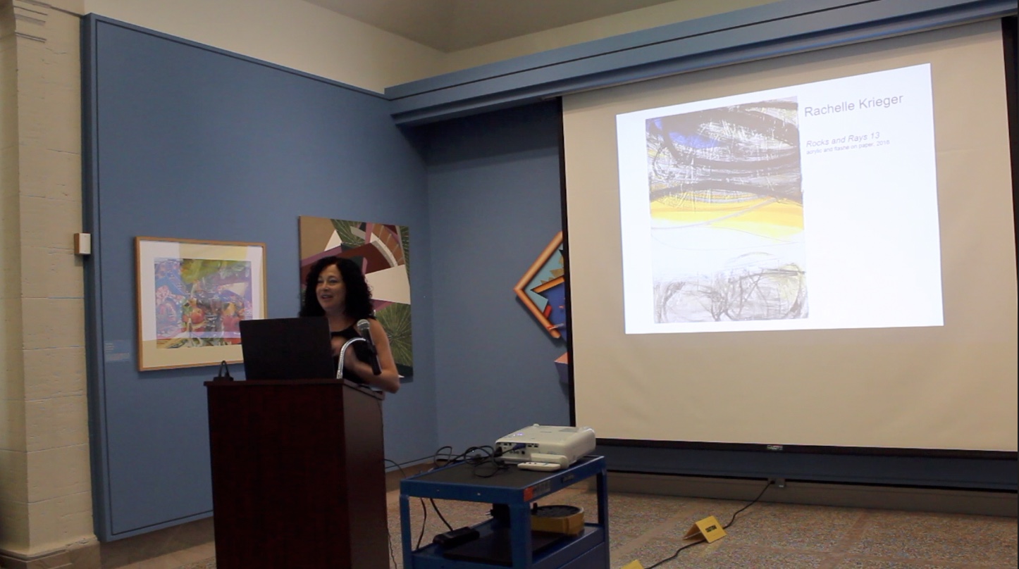 Krieger presenting about creative process and recent paintings