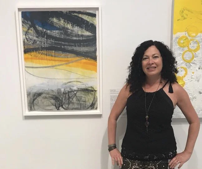 Krieger with her painting “Rocks and Rays 13”