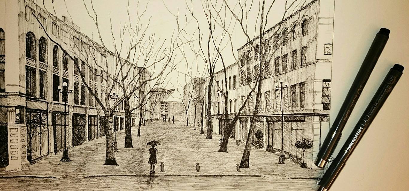 The girl with the red umbrella strolled through Pioneer Square on a rainy Seattle day, admiring the buildings in the quiet before the city came out to watch the Seahawks play.