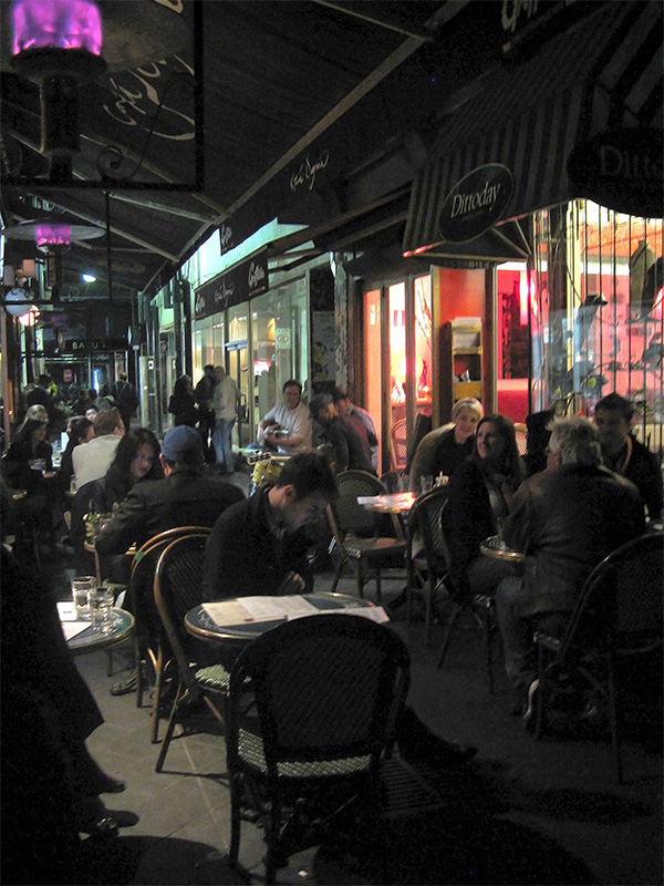 Into the evening, Block Place is bustling with people sitting at one of the cafes spilling into the laneway. Musicians contribute to the atmosphere. Photo by Sarah Oberklaid.