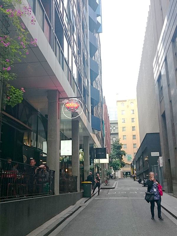 At this end of Russell Place apartments sit above a strip of retail spaces, offering a mix of boutiques, cafés and bars along the lane. Photo by Sarah Oberklaid.