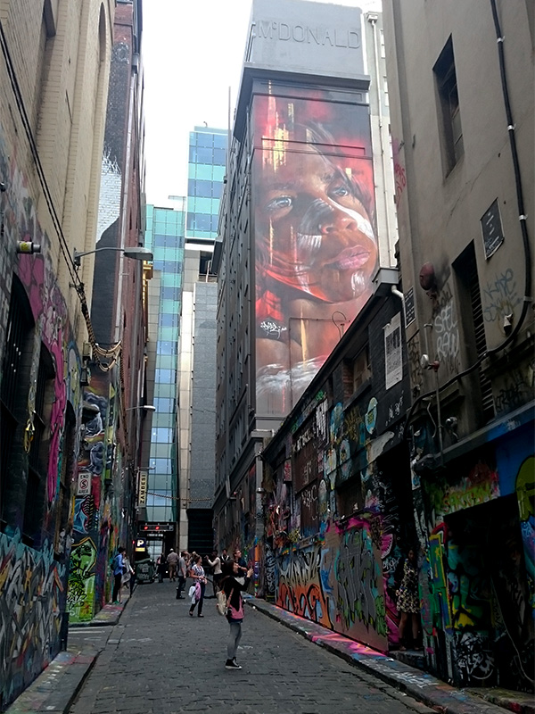 Hoisier Lane is iconic for its street art which blends into a giant wall of color, trickling down to the uneven bluestone paving and wrapping to a connecting laneway. Photo by Sarah Oberklaid.